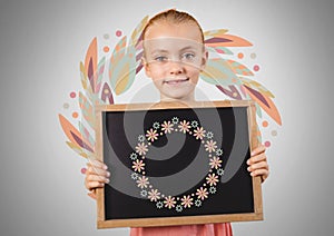 Girl against grey background with blackboard and flower pattern