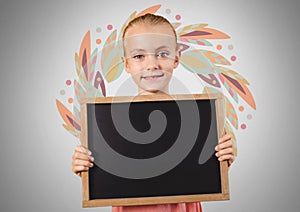 Girl against grey background with blackboard and leaf pattern