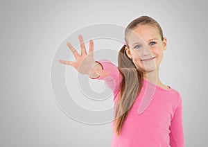 Girl against grey background with hand reached out