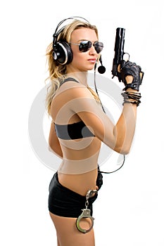 Girl-agent with a gun and handcuffs