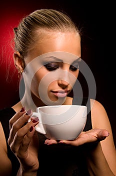 girl with aggressive makeup and white cup