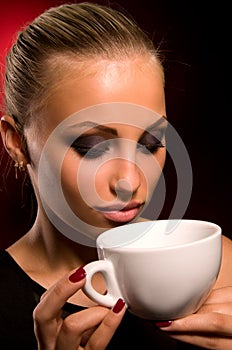 girl with aggressive makeup and white cup