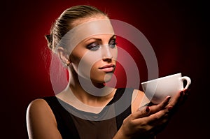 girl with aggressive makeup and white cup