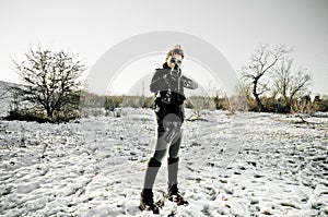 Girl aiming a machine gun