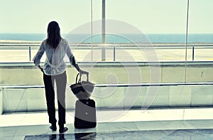 Girl at the airport window