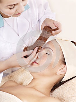 Girl with algae facial mask.