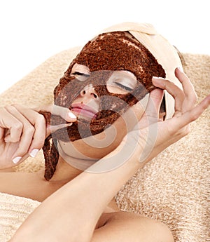 Girl with algae facial mask.