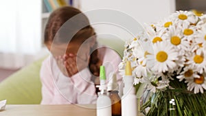 Girl with allergy blowing nose and sneezing