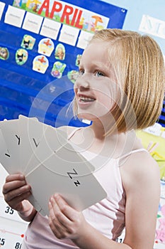 Girl With Alphabet Flash Cards