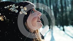Girl amazed by snowy forest background