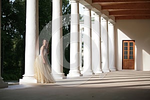 Girl amongst colonnades photo