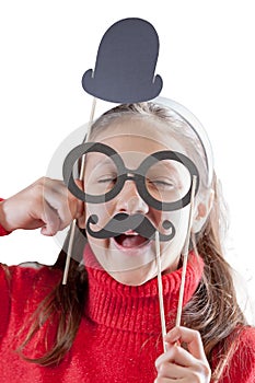 little girl plays smarmy with disguises photo