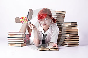 The girl in anime style with candy and books