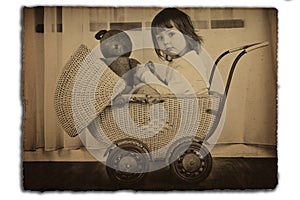 Girl in antique baby carriage