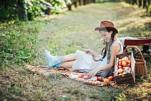 Girl with Apple in the Apple Orchard