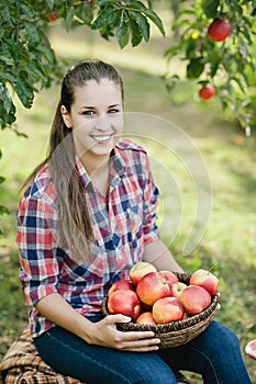 Girl with Apple in the Apple Orchard