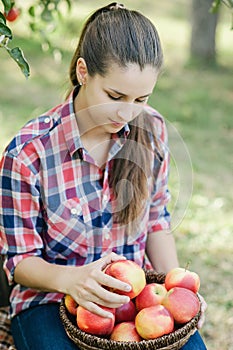 Girl with Apple in the Apple Orchard