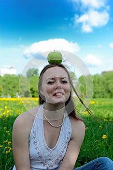 Girl with apple on head