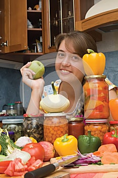 Girl with apple and vegetables photo