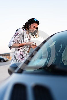 Girl applying face powder outdoor