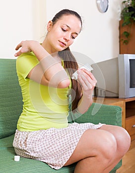 Girl applying gel over bruise