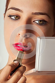 Girl Applying Lipstick