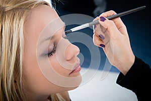 Girl applying make-up