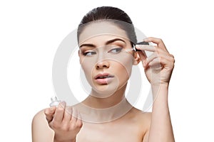 Girl applying serum