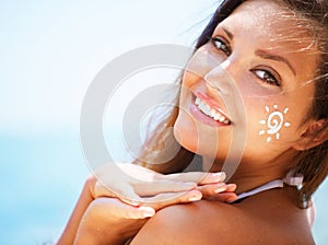 Girl applying Sun Tan Cream