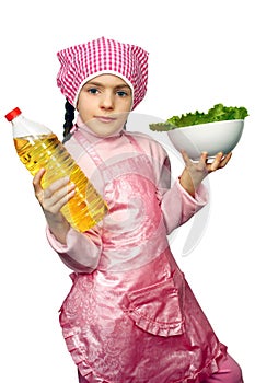 Girl apron with the dish of lettuce