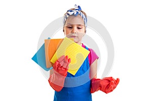 Girl in apron and gloves holding dusters