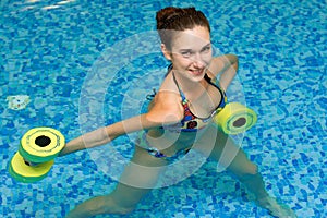 Girl in aqua fitness aerobic