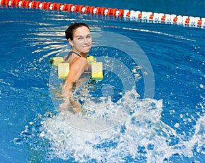 Girl in aqua fitness aerobic