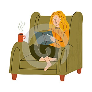 Girl in armchair with book