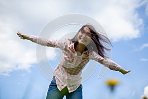 Girl with arms outstretched