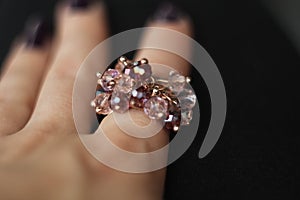 Girl assaying ring at the jewelry store