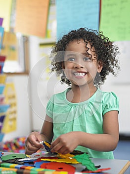 Girl Assembling Puzzles In Classroom