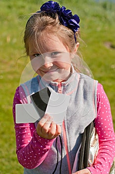 The girl assistant holding the grey card