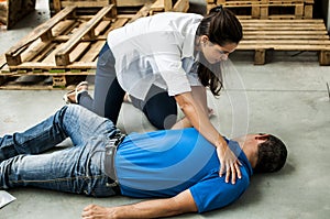 Girl assisting an unconscious man