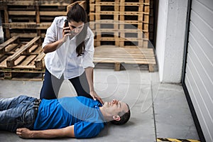 Girl assisting an unconscious man