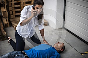 Girl assisting an unconscious man