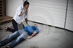 Girl assisting an unconscious man