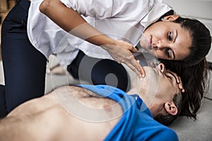 Girl assisting an unconscious man