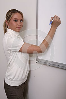 Girl associate at whiteboard close