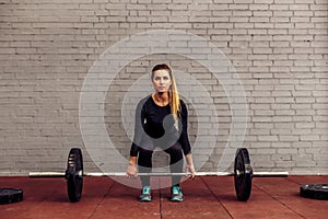 Girl athlete in starting position deadlift