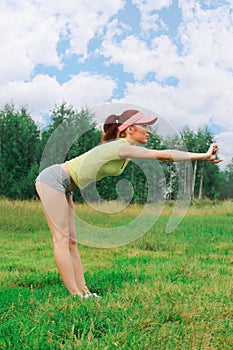 Girl with athletic figure doing exercises o