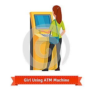 Girl at ATM machine doing deposit or withdrawal