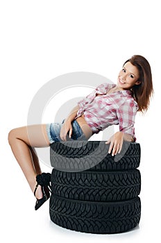 Girl with automobile tyres