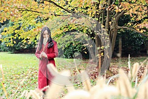 Girl in autumn garden