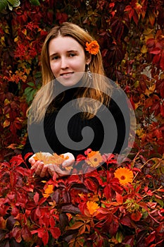 Girl in autumn garden